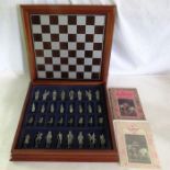 A Danbury Mint Camelot chess set in pewter with booklet and certificate of authenticity in fitted