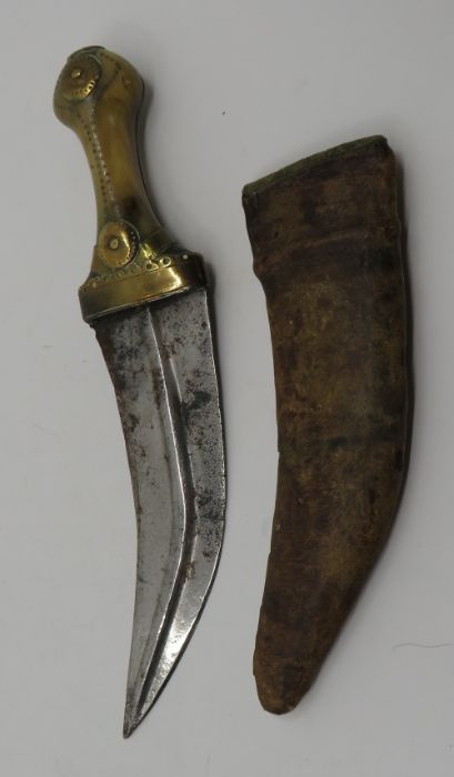 A Sikhs kirpan with a horn and brass handle