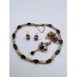 A selection of amethyst and yellow metal jewellery comprising an amethyst and diamond bracelet in