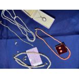 A selection of pearl and imitation coral jewellery, to include two pearl necklaces, two pearl