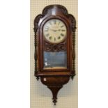 A late 19th century American walnut and inlaid wall clock, having a two train movement. Losses,