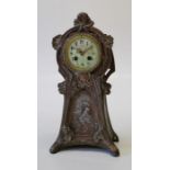 An Art Nouveau French copper patinated spelter mantle clock, the case with figural and floral panels