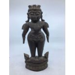A modern Indian carved wooden figure of a man, height 31.3cm.