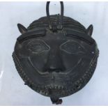 A 20th century Indian bronze circular hanging lantern, having hinged lions mask top and pierced