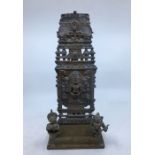 A 20th century Indian cupro-bronze shrine with plaque of Narasimha to centre, the plaque possibly