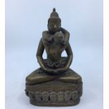 A 20th century Sino-Tibetan bronze figure of Samantabhadra and consort, height 18cm.