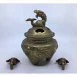 A 20th century Chinese brass censer and cover, having twin slot-on elephant mask handles. the