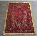 A 19th century Persian tapestry, with embroidered bullion work on burgundy ground, 116cm x 79cm exc.