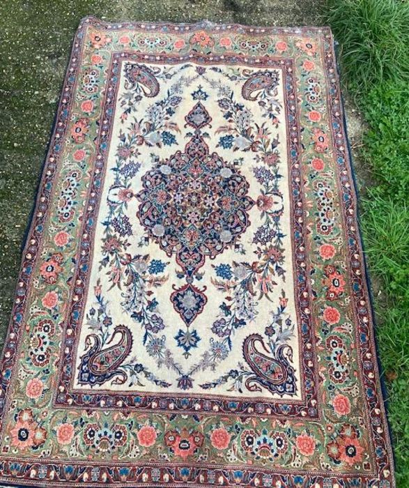 A Persian carpet  204cm x 124cm  no damages