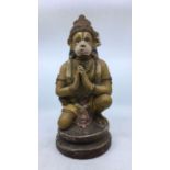 A 20th century Indian polychrome painted figure of praying Hanuman, height 41cm.