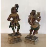 Two 20th century Indian carved and polychrome painted wooden figures of female musicians, the