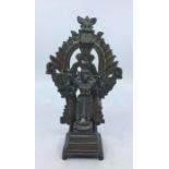 A 20th century Indian bronze figure of a standing four armed deity, in three sections, height 19cm.