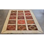 A large Iranian patchwork carpet, each panel of geometric design, 304cm x 202cm