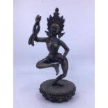 A 20th century Sino-Tibetan white metal figure of deity, probably of a Dakini, height 24.3cm.