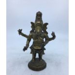 A 20th century Indian brass figure of Ganesha, height 18cm.