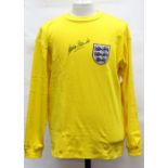 England: A signed replica England goalkeeper shirt, signed by Gordon Banks.