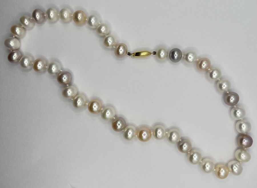 A strand of multicoloured cultured pearls approx 10mm in diameter with a 9ct gold clasp.