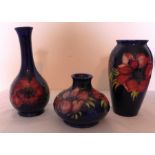 A trio of Moorcroft vases, in the Hibiscus pattern with blue background impressed Moorcroft and