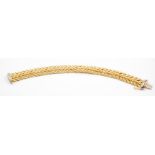 A 9ct gold fancy link bracelet, set with ten melee diamonds across each half of the box clasp.