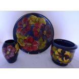 A trio of Moorcroft items, in the Hibiscus pattern with blue background impressed Moorcroft and