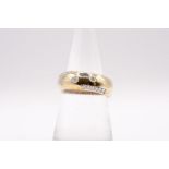 A 9ct gold diamond set band ring. Size N. Approximate weight 6.5 grams. (1)