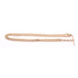 A 9ct rose gold necklace with a T-bar pendant. Gross weight approximately 19.6 grams. (1)
