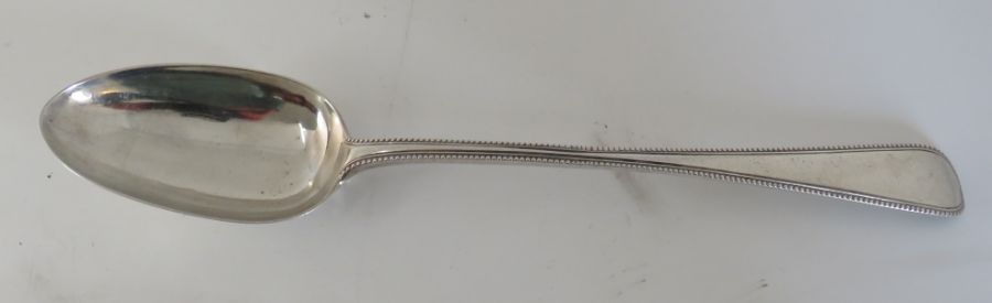 A Victorian silver basting spoon with beaded border by George Adams, London 1865, a triangular pin - Image 2 of 2