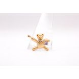 A 9ct yellow gold teddy bear pendant set with a single tanzanite. Gross weight approximately 2.4