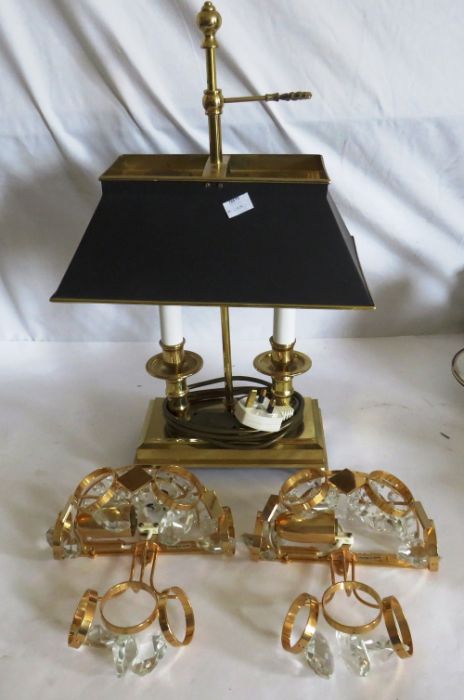 An electric table lamp and 2 wall lights with crystal droplets .