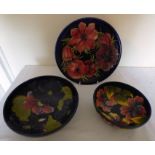 A trio of Moorcroft items, to include a charmer and two fruit bowls in varying patterns with blue