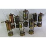Collection of 8 Miners lamps to include a 2 Wolf safety lamps, 2 E Thomas and Williams, protector