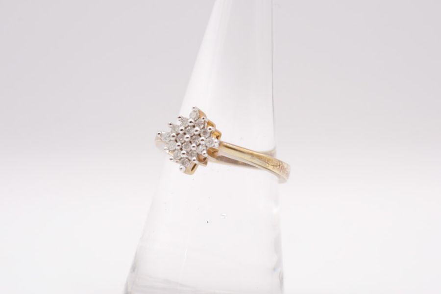 A 9ct gold diamond cluster ring. Gross weight approximately 2.9 grams, Size N.