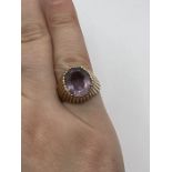 A raised setting textured Amethyst ring. Size K. Gross weight approximately 5.6 grams. (1)