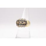 A 9ct gold Sapphire and diamond ring. Gross weight approximately 4.7 grams. Size M1/2. (1)