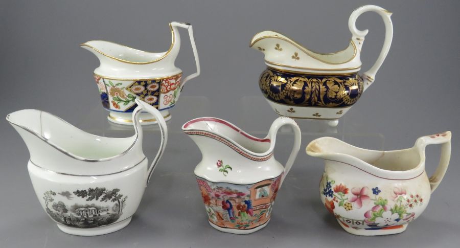 A group of early nineteenth century porcelain hand-painted creamers, c. 1820. To include Derby,