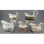 A group of early nineteenth century porcelain hand-painted creamers, c. 1820. To include Derby,