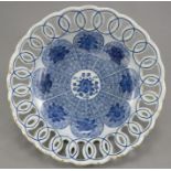 A mid to late eighteenth century tin-glazed blue and white delft ware bowl with open, lattice-work