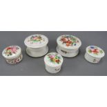 A group of five mid to late nineteenth century hand-painted porcelain circular pots and covers, c.