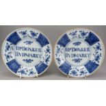 A superb pair of eighteenth century tin glazed earthenware blue and white delft dedicated plates, c.