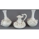 A group of mid-nineteenth century Derby white porcelain flower encrusted wares, c. 1865. To