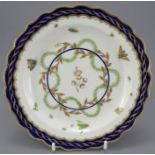 A late eighteenth century hand-painted Worcester porcelain plate, c. 1770. It is marked to the