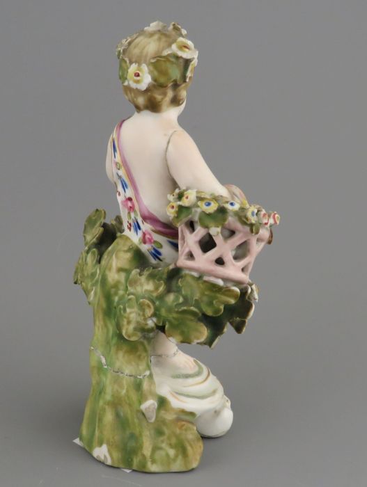 A late eighteenth century porcelain Derby cherub with applied floral decoration and hand-painting, - Image 2 of 2