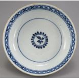 A mid to late eighteenth century tin-glazed blue and white delft ware bowl with simple floral