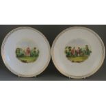 A pair of hand-painted and titled porcelain large saucer dishes, c. 1840-60. One is titled; "The