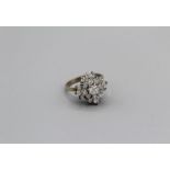 A diamond snowflake cluster ring in 18ct gold with an estimated 1.5ct of diamond in total, gross