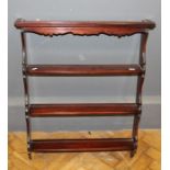 A 20th century mahogany set of three tier open wall mounting display shelves of small size, 79 x