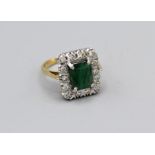 An emerald and diamond cluster ring in yellow and white metal, size Q, approx 6.5gm in vintage case,