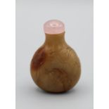 Chinese snuff bottle. Chalcedony of compressed pear shape resting on a flat oval base, delicately