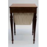 An Edwardian mahogany, boxwood strung sewing table, the crossbanded rectangular hinged top over
