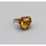 A heart shaped citrine cocktail ring in yellow metal, stamped 18k, size J, gross weight 8.0gm
